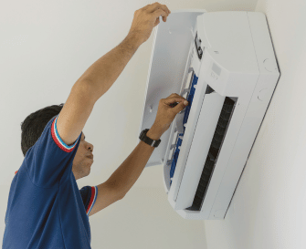 technician checking aircond drainage pipe